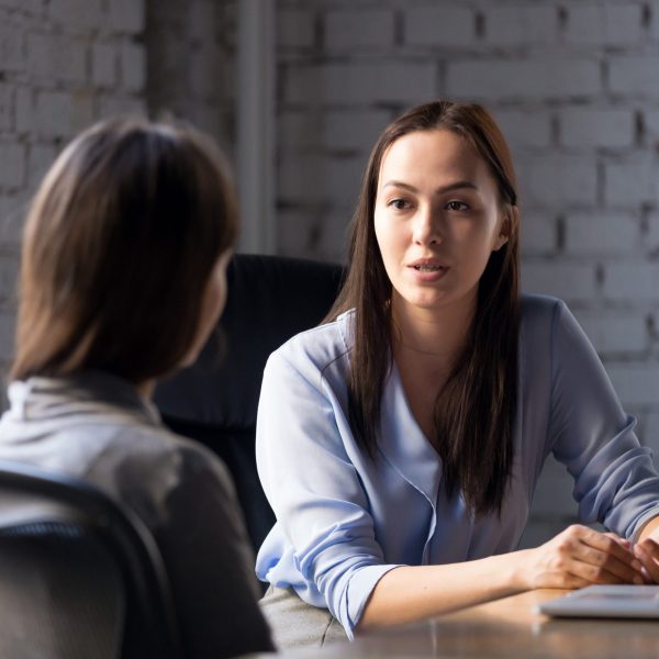 Serious,Professional,Female,Advisor,Consulting,Client,At,Meeting,Talking,Having